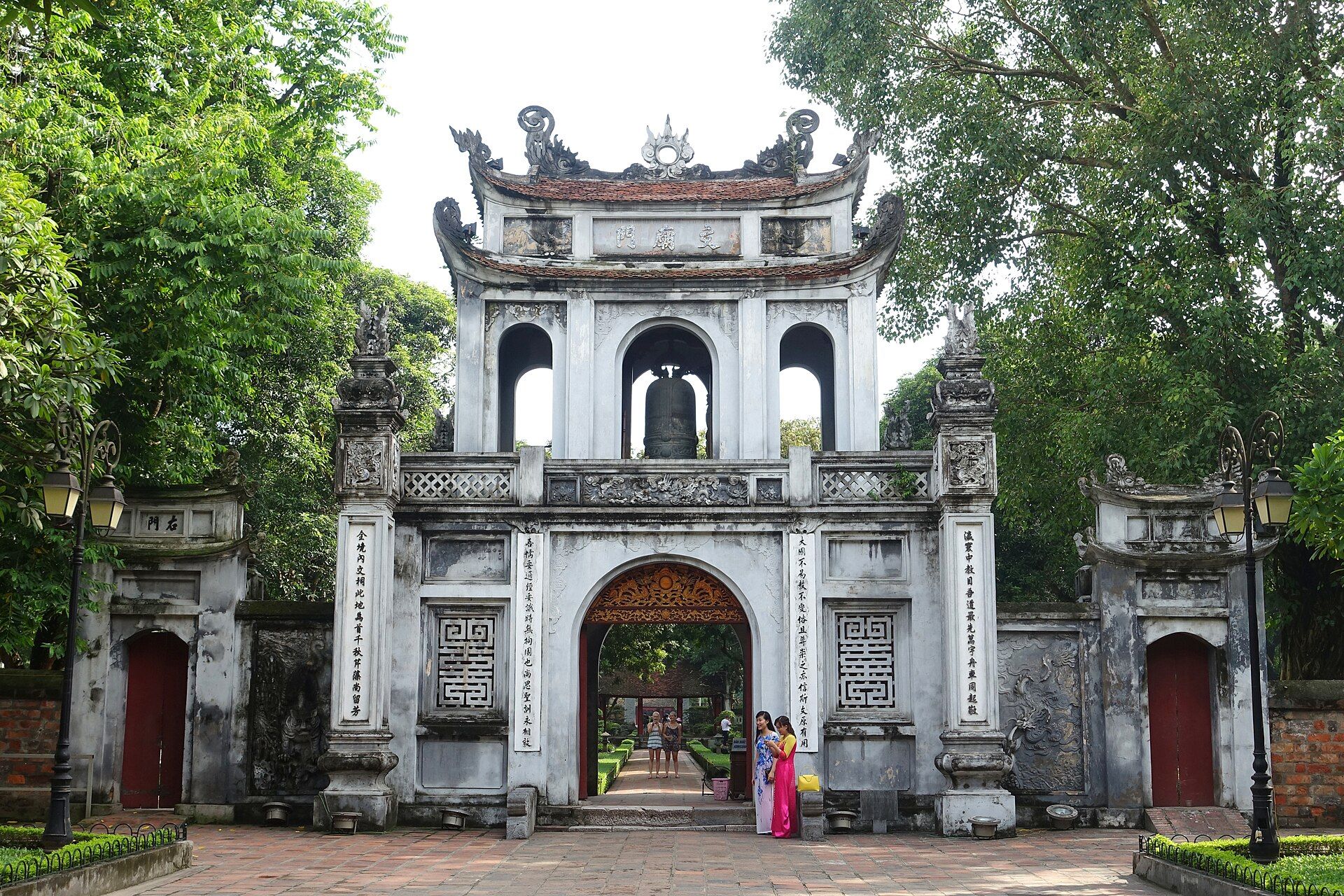 The triple-arched main gate of the Temple of Literature behind a courtyard