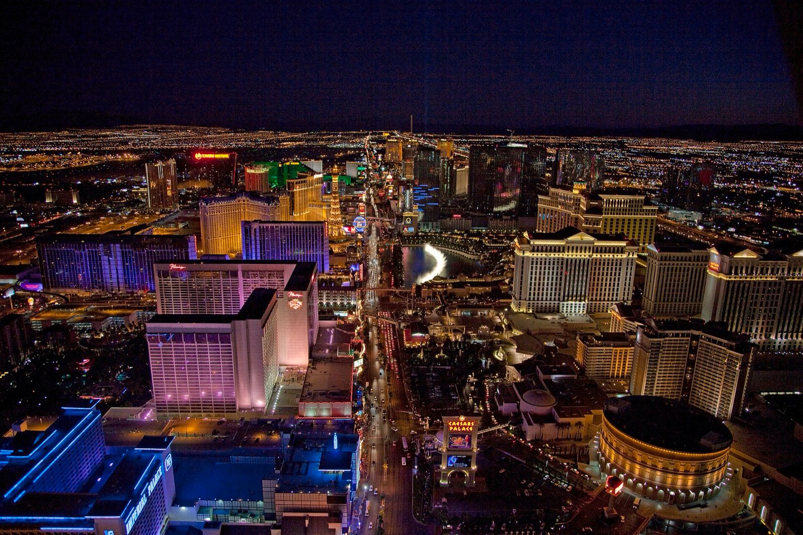 The Las Vegas Strip at night from the air, lit along its whole length
