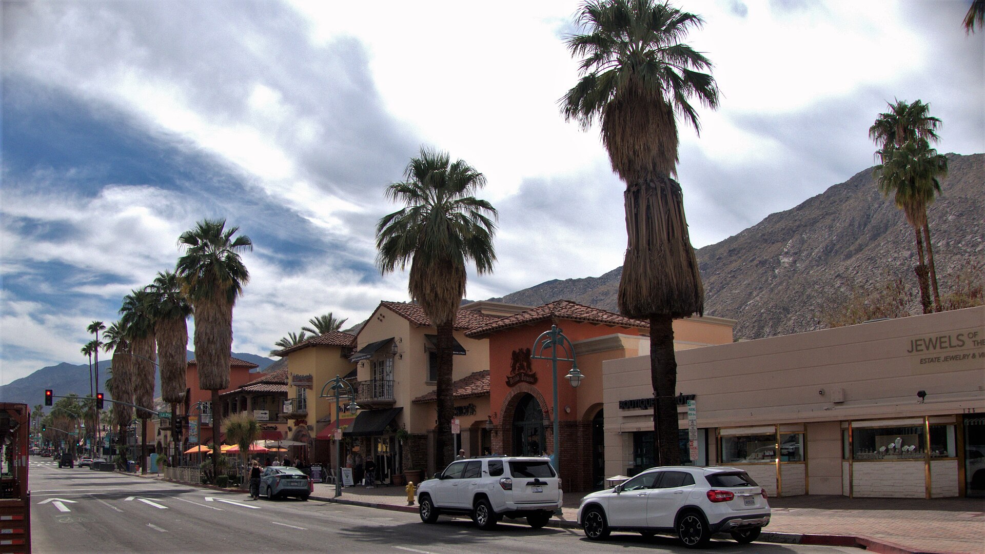 Palm Canyon Drive in downtown Palm Springs, lined with palms and low shopfronts