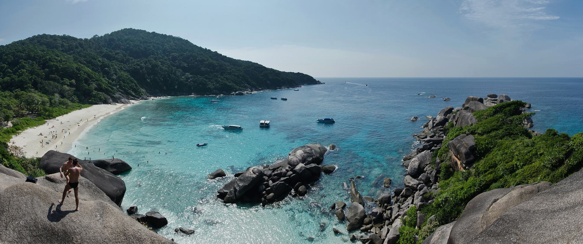 Granite boulders and turquoise shallows on Similan Island 8, seen from the ridge above the bay