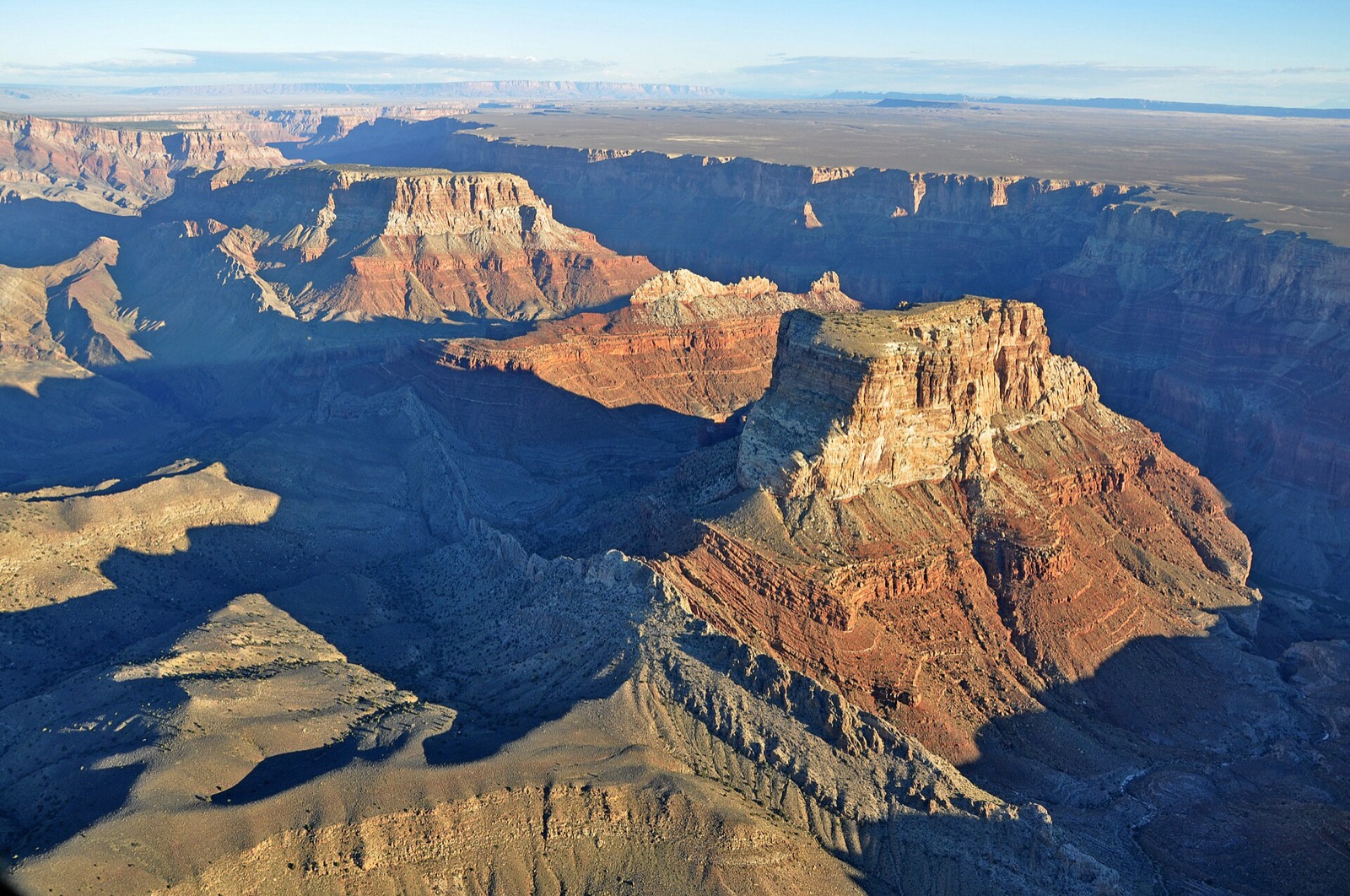 The Grand Canyon seen from the air, buttes and side canyons in low sun