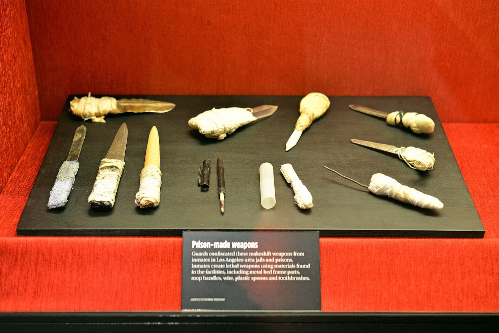 A display of confiscated weapons in a case at the Mob Museum