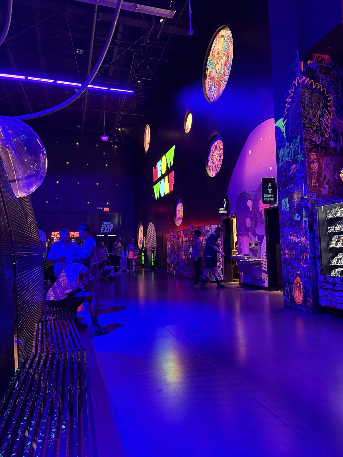 The brightly lit surreal interior of the Omega Mart installation