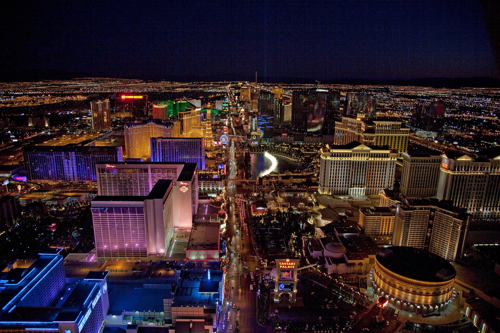 The Las Vegas Strip at night from the air, lit along its whole length